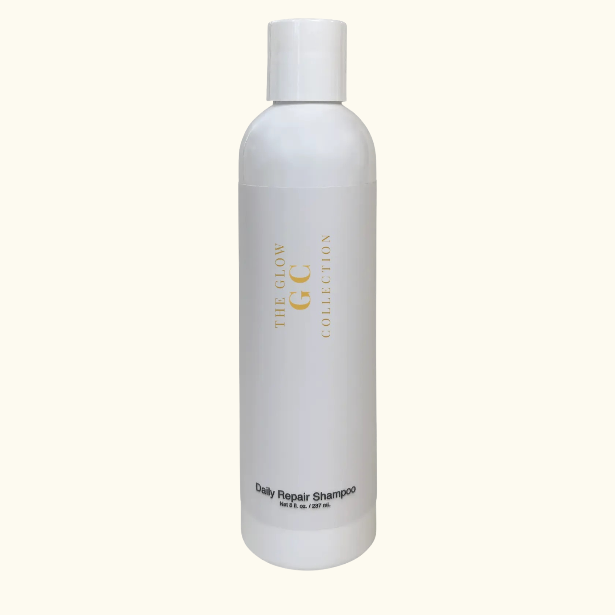 White shampoo bottle with 'The Glow Collection' branding on a white background