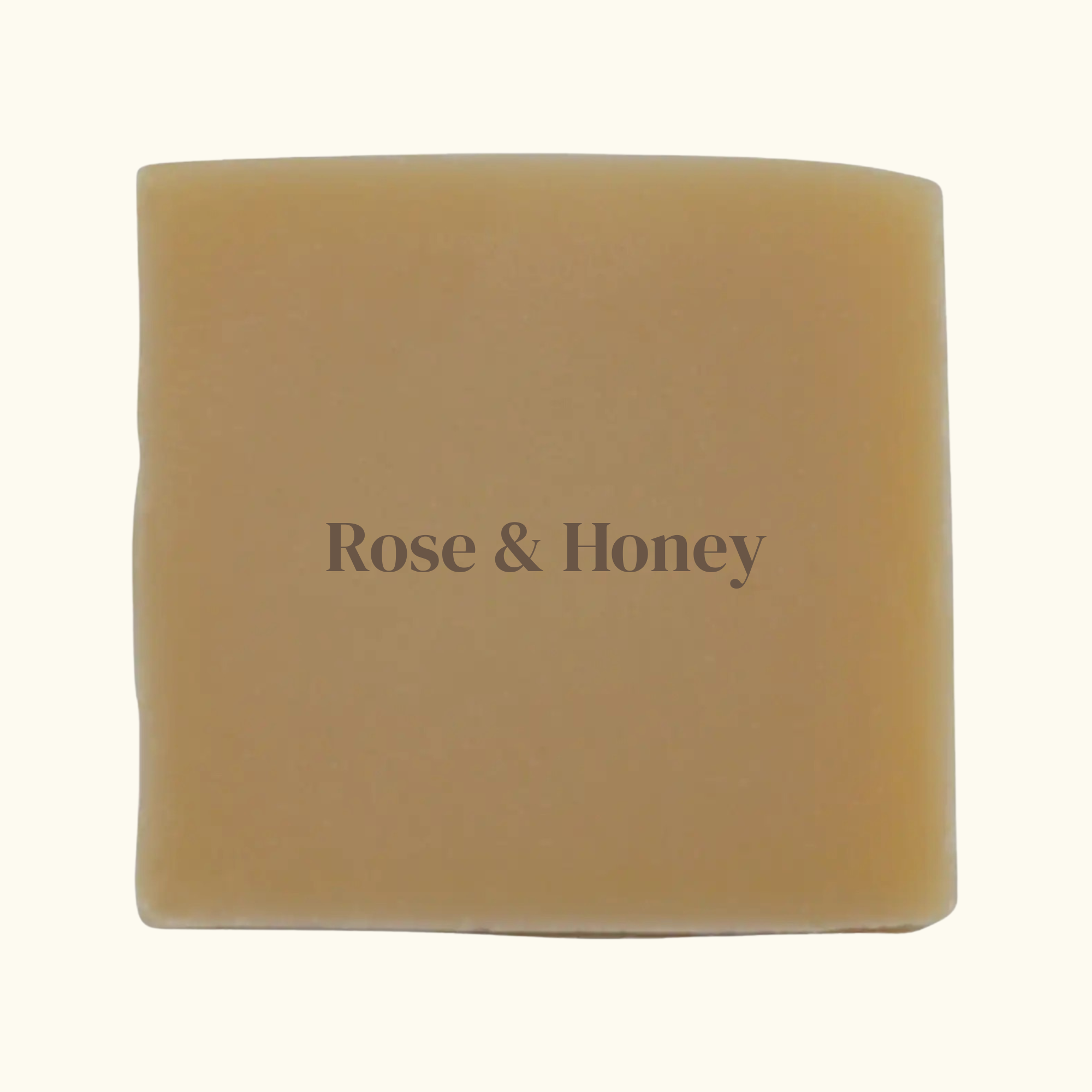 Bar of soap with 'Rose & Honey' text on a beige background