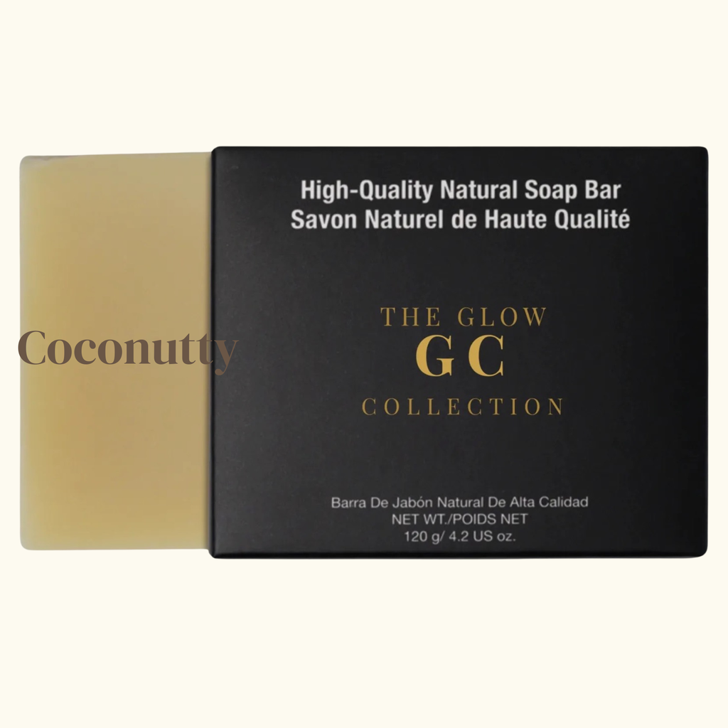 Coconutty soap bar next to its packaging with 'The Glow GC Collection' branding.