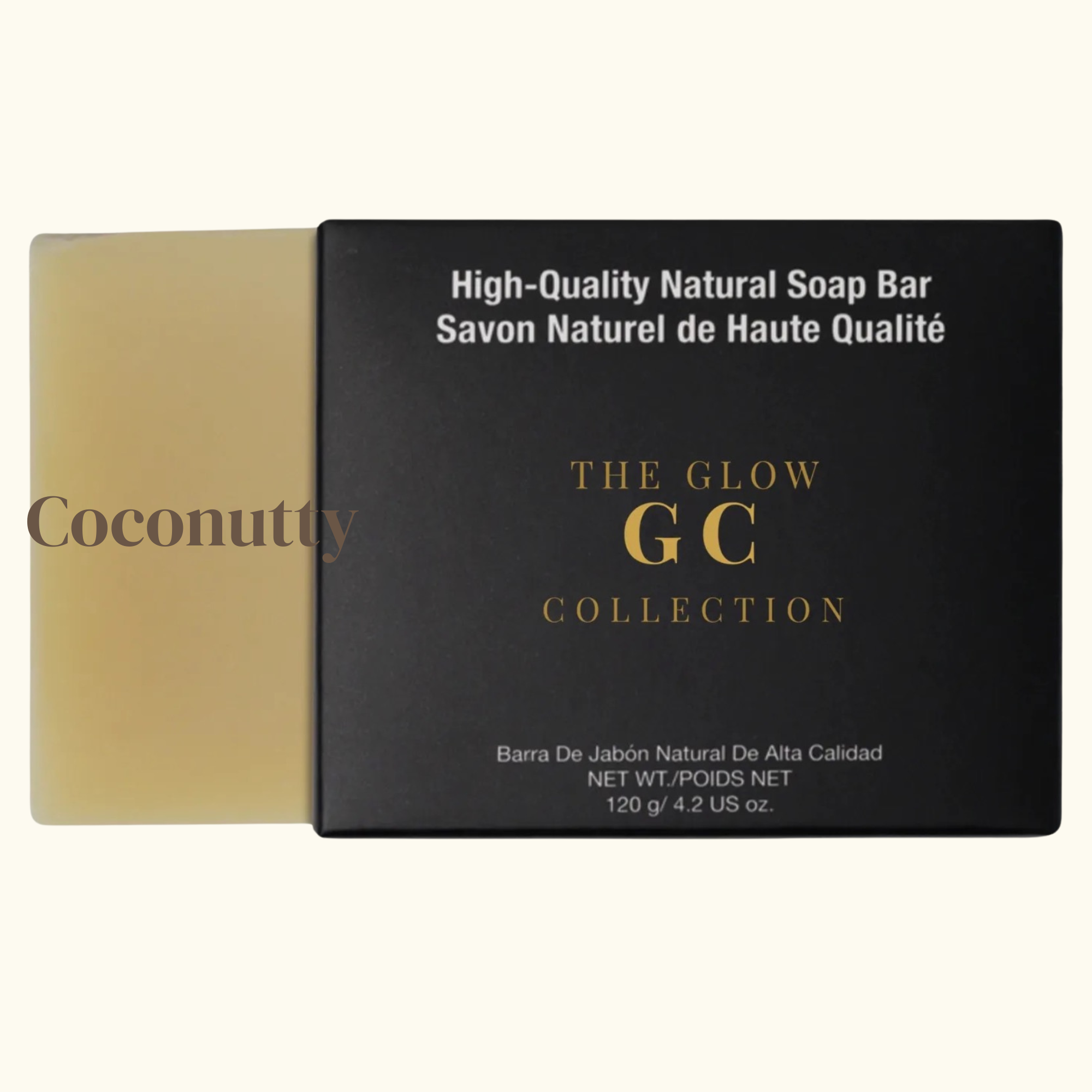 Coconutty soap bar next to its packaging with 'The Glow GC Collection' branding.